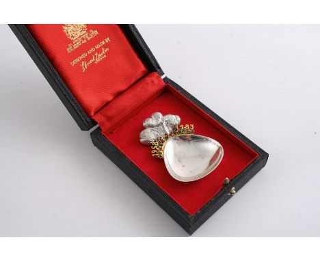 BY STUART DEVLIN: A modern limited edition commemorative caddy spoon, with parcelgilt & enamelled decoration, London 1983 wit