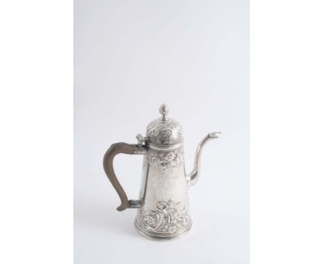 A GEORGE I TAPERING COFFEE POT with a domed cover, bud finial, an engraved coat of arms & embossed decoration on the cover & 