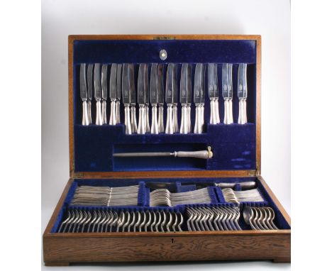 A MODERN PLATED CANTEEN OF FLATWARE & CUTLERY with reed & ribbon borders in a fitted oak box including: Twelve table forks, s