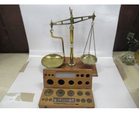 A Leicester Scale company Class B set of Scales together with a boxed set of weights&nbsp;