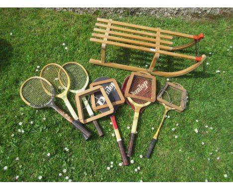 A vintage sledge and a collection of tennis rackets