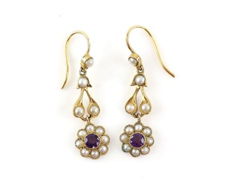 A pair of Edwardian amethyst and seed pearl drop earrings, with hook fittings, mount testing as 15 ct, measurements 3 x 0.9cm