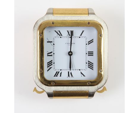 Cartier steel and gilt brass cased travel alarm clock, Cartier Paris signed white dial, with Roman numerals and minute track,