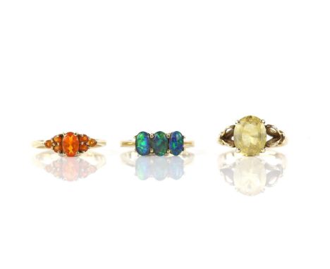 Three rings, including, a Opal triplet three stone ring, size K, a citrine ring, with a central oval pale citrine, size I 1/2