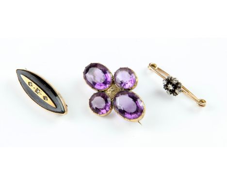 Three antique brooches, including an onyx and diamond mourning brooch, navette shaped onyx, with an applied gold panel to the