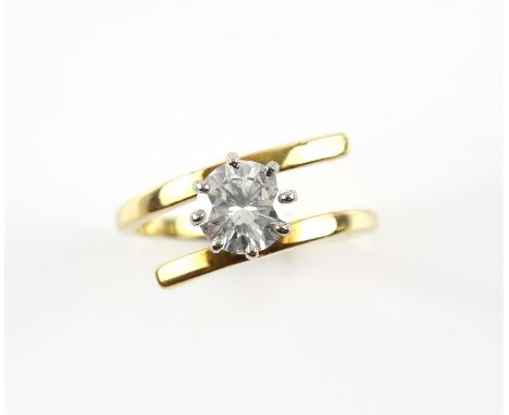 Contemporary diamond twist ring, set with a round brilliant cut diamond, estimated weight 1.03 carats, mount testing as 18 ct