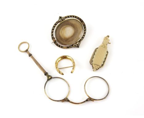 Victorian mourning brooch, central oval panel with hair work, surrounded by a twisted black enamel boarder, reverse has portr
