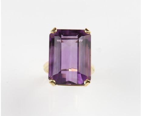 Amethyst cocktail ring, with a step cut amethyst, weight estimated 24.4 carats, in a four claw setting, in a 18 ct yellow gol