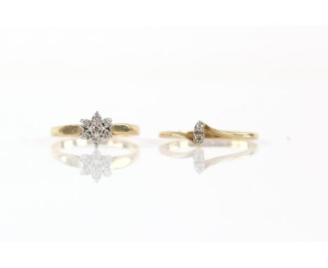 Two diamond rings, including, a star shaped cluster ring, with seven small round cut diamonds, size K, and a marquise shaped 