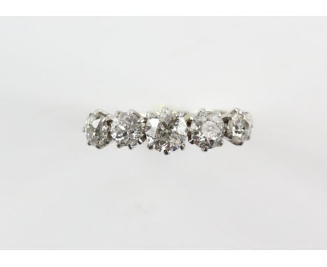 Early 20th Century, five stone diamond ring, with five old mine cut diamonds, in a claw setting, total estimated weight 1.40 