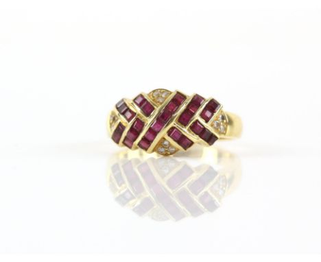 Ruby and diamond vintage ring, with twelve small round cut diamonds and twenty-seven carre cut rubies, in a channel and rub o