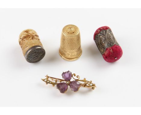 French boxed thimble sewing set, with an an ornate engraving 18 ct yellow gold thimble, and an Edwardian  amethyst and seed p