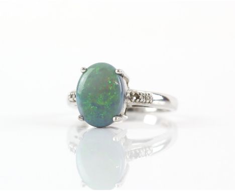 Boulder opal doublet ring, with five small round cut diamonds, in hallmarked 18 ct white gold, Birmingham 2008, ring size OCo