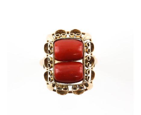 Vintage coral ring, with two coral barrel shaped beads to the centre, in an openwork gold frame, tested as 14 ct, with contin
