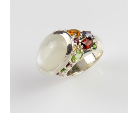 Moonstone and gem set ring, central oval cabochon cut moonstone measuring 16.86 x 12.76 x 5.93mm, weighing a calculated 8.56 