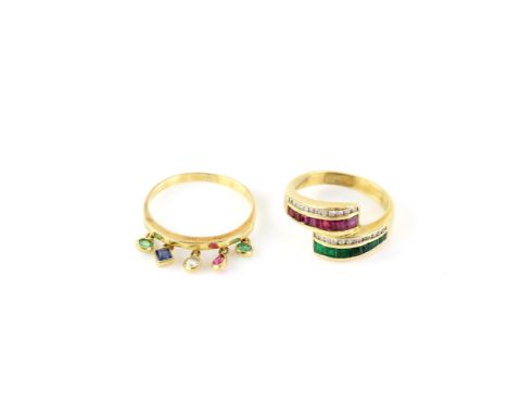 Two rings, including, an emerald, ruby and diamond ring, with seven carre cut emeralds and seven carre cut rubies in a channe