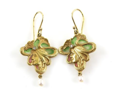 Art Nouveau style earrings, depicting a profile of a lady with swirling floral detail, set with round brilliant cut diamonds,