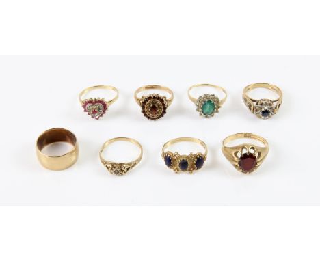 Eight rings, including an emerald and CZ cluster ring, size M, a ruby and diamond ring in a heart design, size M, two garnet 