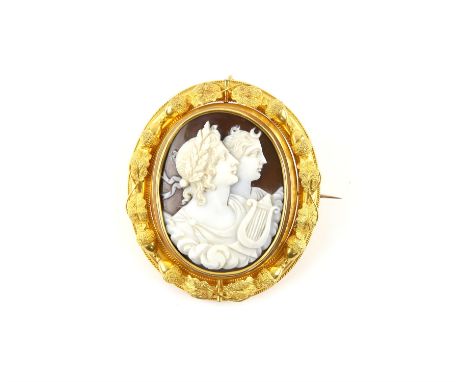 AMENDED DESCRIPTION Antique cameo brooch, the central, reversible panel, depicting Apollo, holding a lyre with his sister Dia