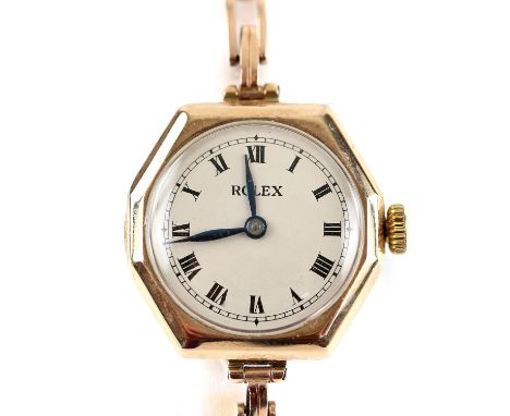 Rolex, a octagonal cased gold wristwatch, the signed white enamel dial with Roman numeral hour markers within a minute track,