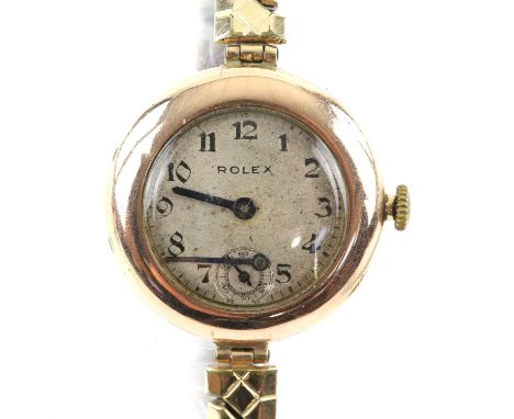 Rolex, a gold ladies wristwatch, the silvered signed dial with Arabic numeral hour markers and steel hands, fitted with a Pri