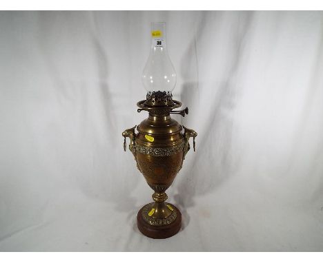 A Wright & Butler improved Duplex burner oil lamp, approximately 