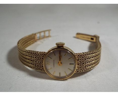 A lady's 9 carat gold wristwatch  by  Garrard, case weight 15g, assay marks to the case for London 1972, with 17-jewel manual