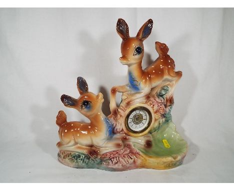 A vintage Bambi / Babysham fawn clock with integrated pipe stand and ashtray, marked Made in Italy