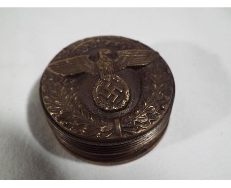 A snuff box with screw release lid