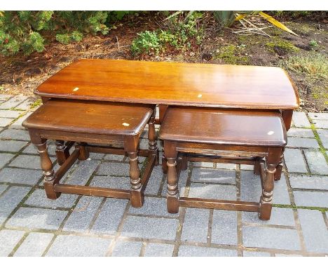 An Ercol coffee table with nesting occasional tables, 42cm x 113cm x 48cm - (3)