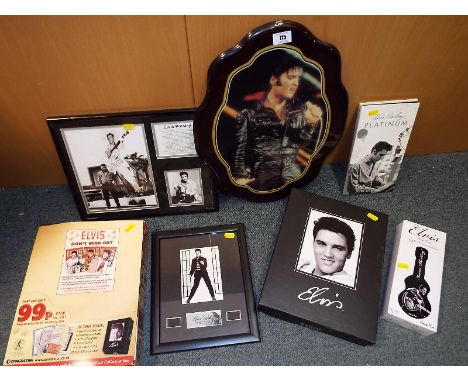 A collection of Elvis Presley memorabilia to include an Elvis Presley framed print with a film cell, an Elvis Presley tin con