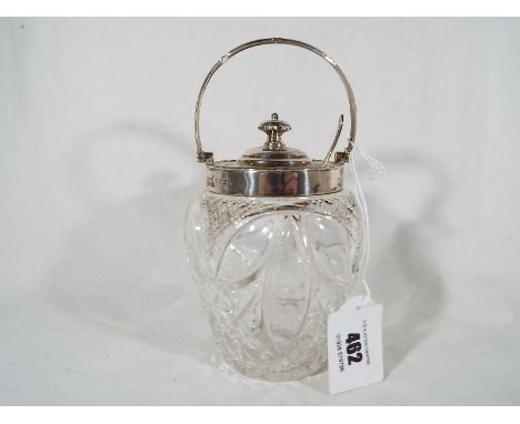 An Edward VII silver cut glass preserve pot with hallmarked silver rim, swing handle and cover, Sheffield assay 1905 and a ha