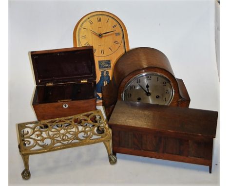 A Regency rosewood tea caddy of sarcophagus form, together with a 1930s oak cased mantel clock, pierced brass trivet etc