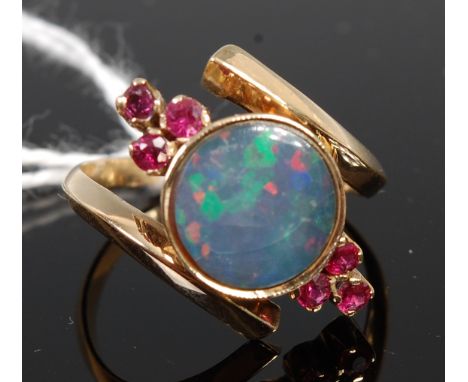 An 18ct gold, doublet opal and small ruby set dress ring, 3.8g, size P/Q