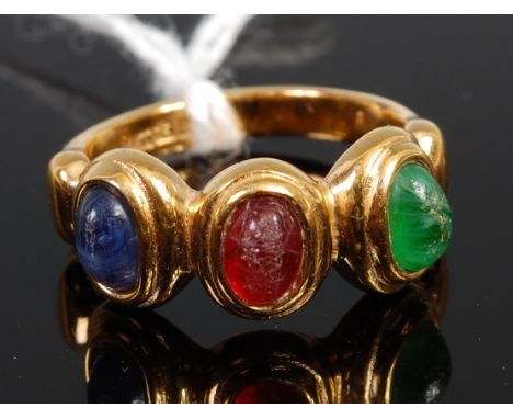 A 14ct gold dress ring, set with a single cabochon emerald, ruby and sapphire, 4.9g, size N