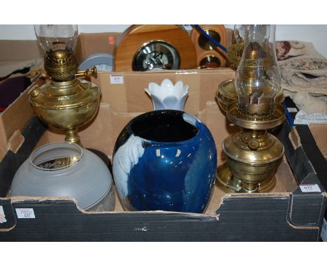 A box of mixed effects to include Art Nouveau brass oil lamp, two further brass oil lamps, art glass vase, and a further cera