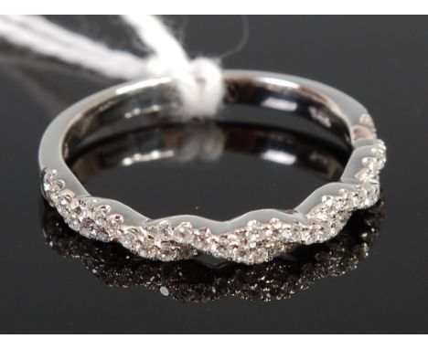 A 14ct white gold diamond point set half eternity ring, 2.3g, size N