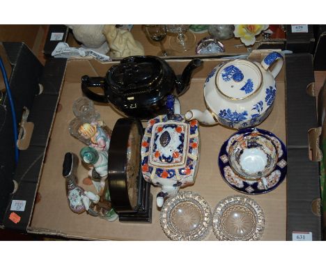 A box of mixed effects to include three various ceramic teapots, pair of glass ashtrays, figural group etc