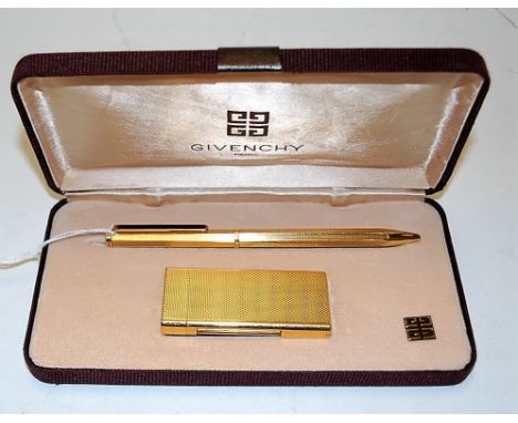 A modern Givenchy textured gilt pocket cigarette lighter together with a matching ballpoint pen in fitted case