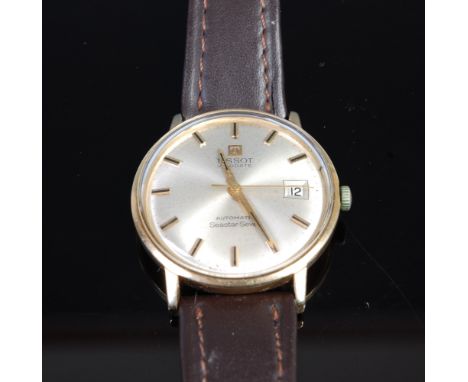 A gents Tissot Seastar 7 Visodate 9ct gold cased wrist watch having signed champagne dial, automatic movement, 3.4cm   Condit