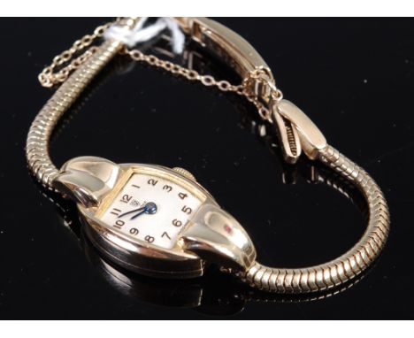 A ladies Tudor 9ct gold cased bracelet watch (lacking glass) having a champagne dial, Arabic numerals, manual wind movement a