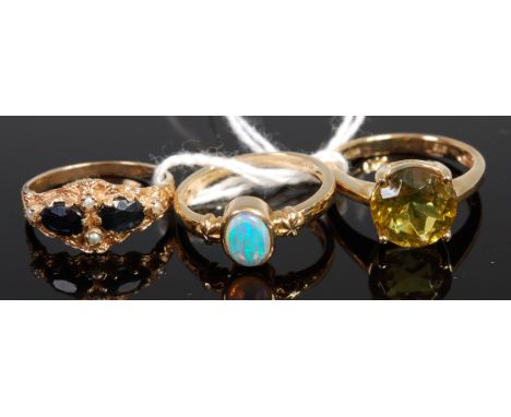 A Victorian style 9ct gold, black onyx and seed pearl set ring; together with a modern 9ct gold and opal set ring; and one ot