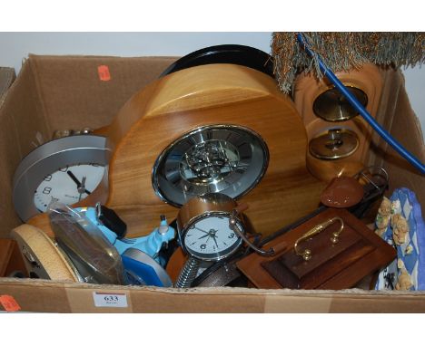 A box of contemporary table and mantel clocks