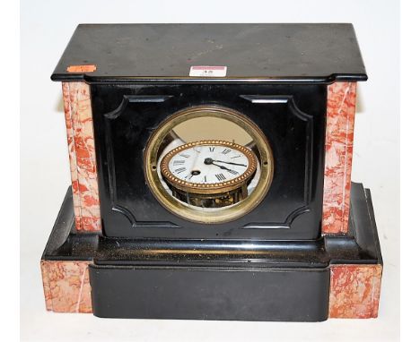 An Edwardian black slate and rouge marble mantel clock, having enamelled dial with Roman numerals (a/f) 