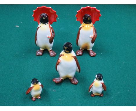 SET OF FIVE BESWICK GLAZED CERAMIC PENGUINS (AT FAULT) 