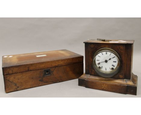 A Victorian rosewood writing slope and a Victorian inlaid mantle clock. The clock 21.5 cm high.