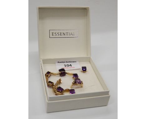 A 9 ct gold suite of jewellery, comprising of an amethyst bracelet, a pair of earrings and a ring. The bracelet 17.5 cm long,