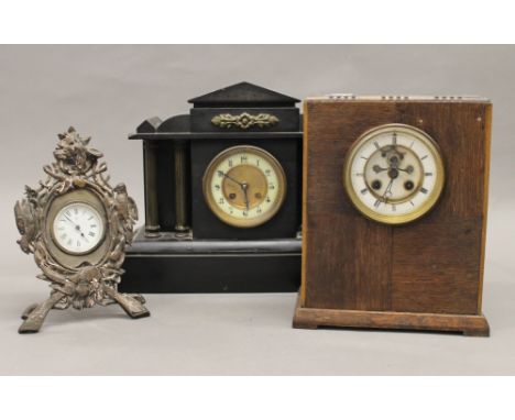 A Victorian black slate mantle clock, together with two other clocks
