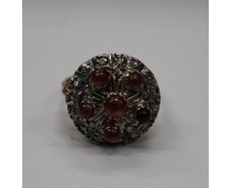 An antique 18 ct gold ruby and diamond chip ring. Ring size L (6.5 grammes total weight)