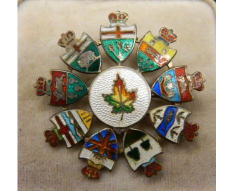 A Canadian sterling silver enamel flag brooch.  4 cm diameter.